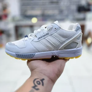 کفش اسپرت مردانه آدیداس زد ایکس سفید با طراحی مینیمال و کفی نرم – مناسب ورزش سبک و پیاده‌روی روزانه | کفشدونی